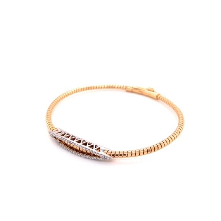 This bangle bracelet from Simon G. features 0.20 carat total weight in round brilliant cut diamonds set in 18 karat rose and white gold. Stack this bracelet with others for a unique look or let it make a statement alone. This can fit up to a 6.75
