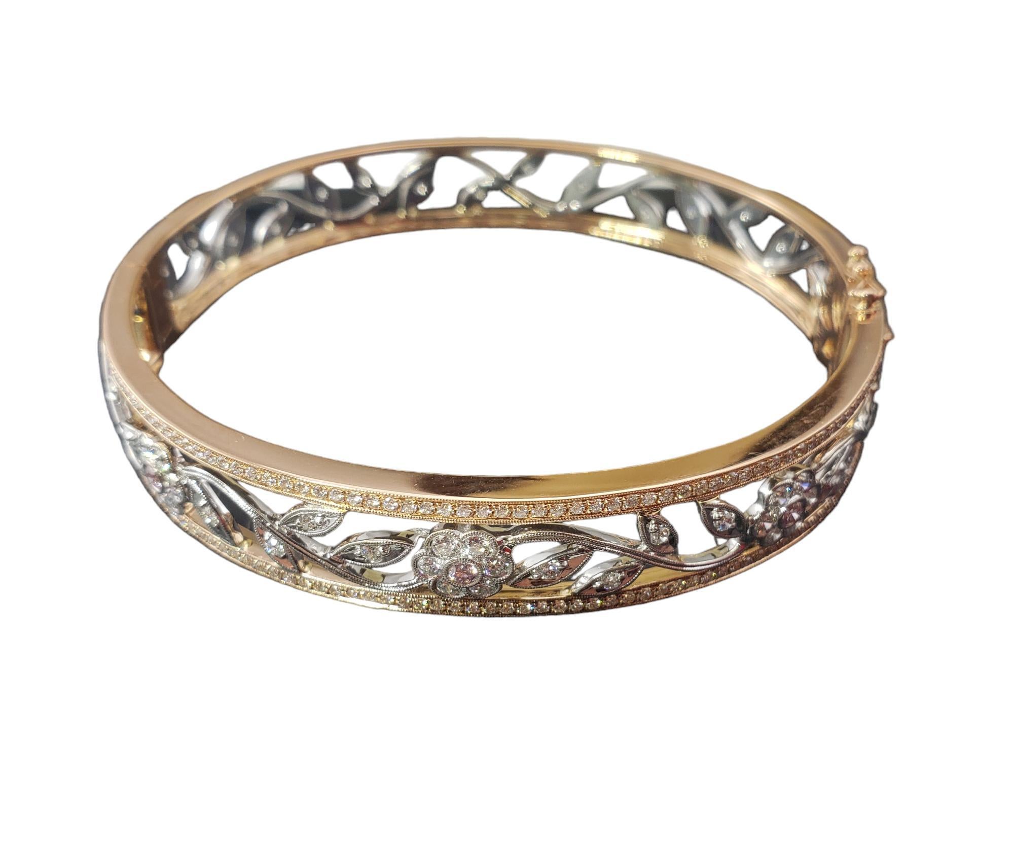 Simon G. 14K Two Tone Gold and Diamond Bangle Bracelet-

This lovely hinged 18K gold bangle bracelet by Simon G. features pink and white round brilliant cut diamonds set in a stunning floral design.  

Width: 11 mm.

Approximate total white diamond