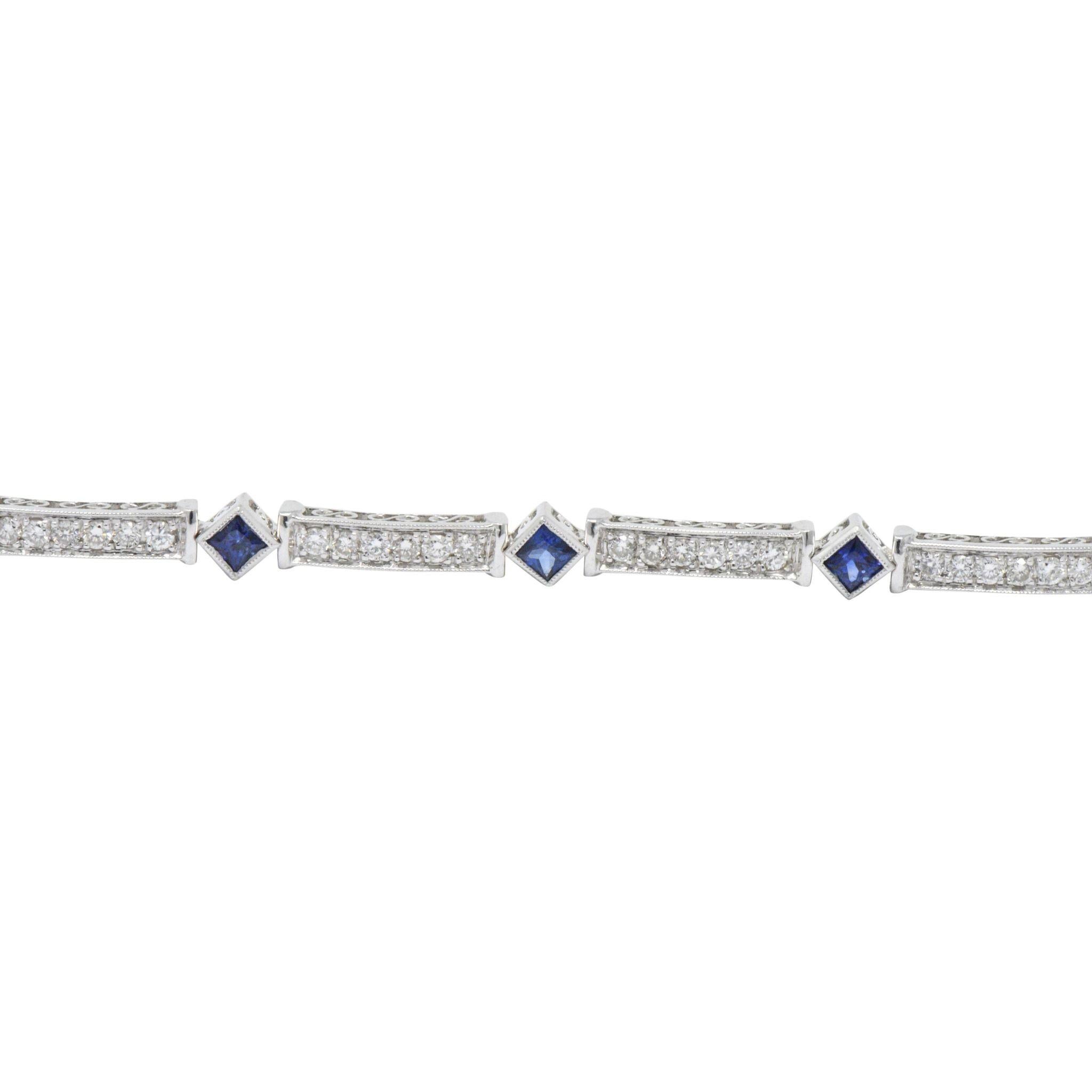 Line bracelet comprised of rectangular diamond links alternating with square cut sapphire spacer links

Bead set round brilliant cut diamonds weigh in total 1.18 carats, G/H color with VS to SI clarity

Bezel set sapphire weigh 1.33 carats total;