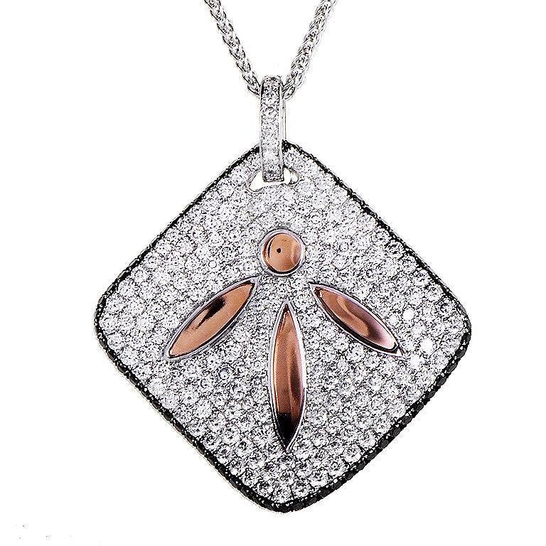 This pendant necklace from Simon G. is light and unique. It is made primarily of 18K white gold and boasts a square shaped pendant accented with a cut out leaf design. The pendant is accented with 18K rose gold and is set with ~2.72ct of diamonds.
