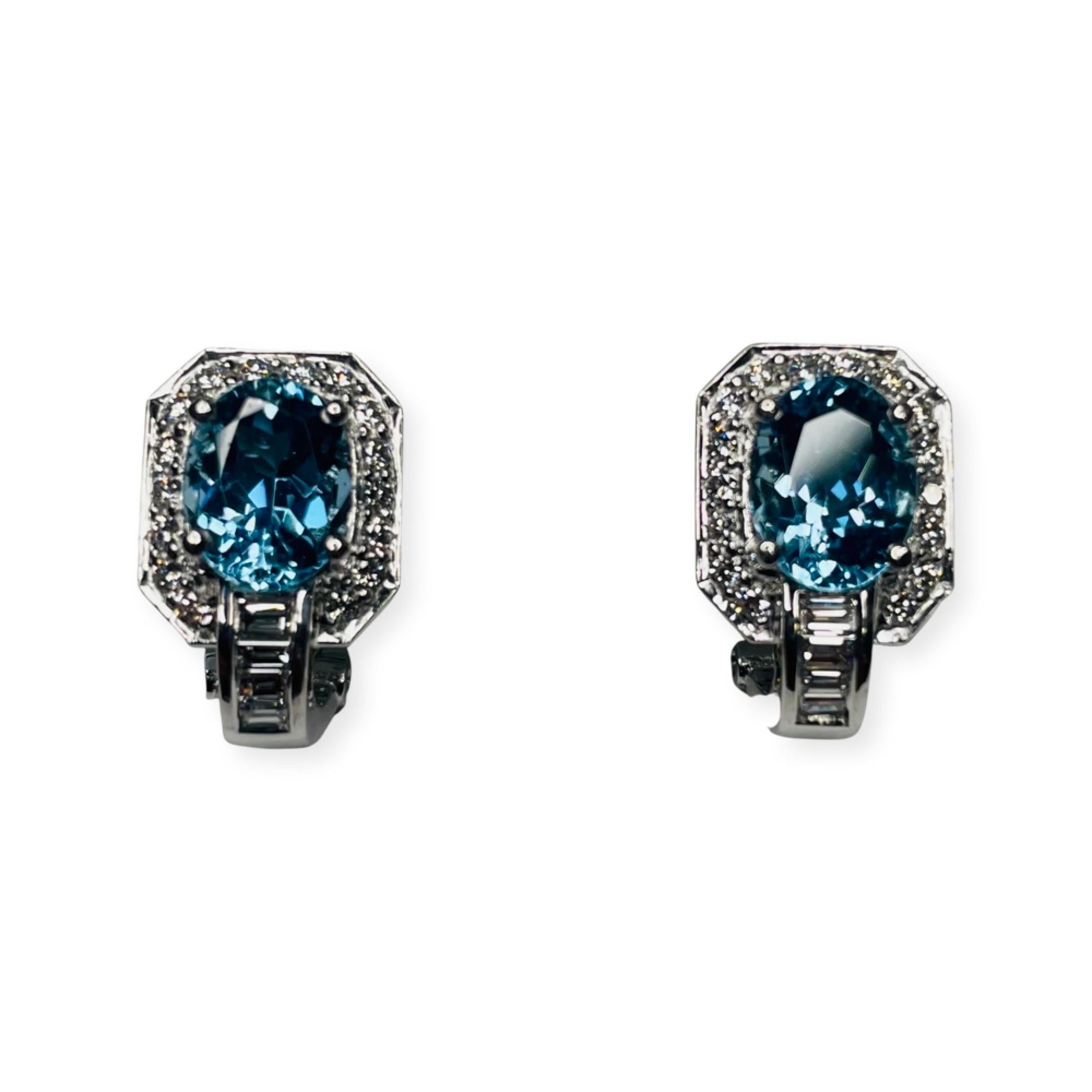 Simon G 18K White and Yellow Gold Aquamarine and Diamond Earrings. The earrings measure 17.25 mm x 11.0 mm. The natural aquamarines measure 9.5mm x 7.0 mm. They have a total weight of 3.54 carats. They are prong set. There are 16 full cut round