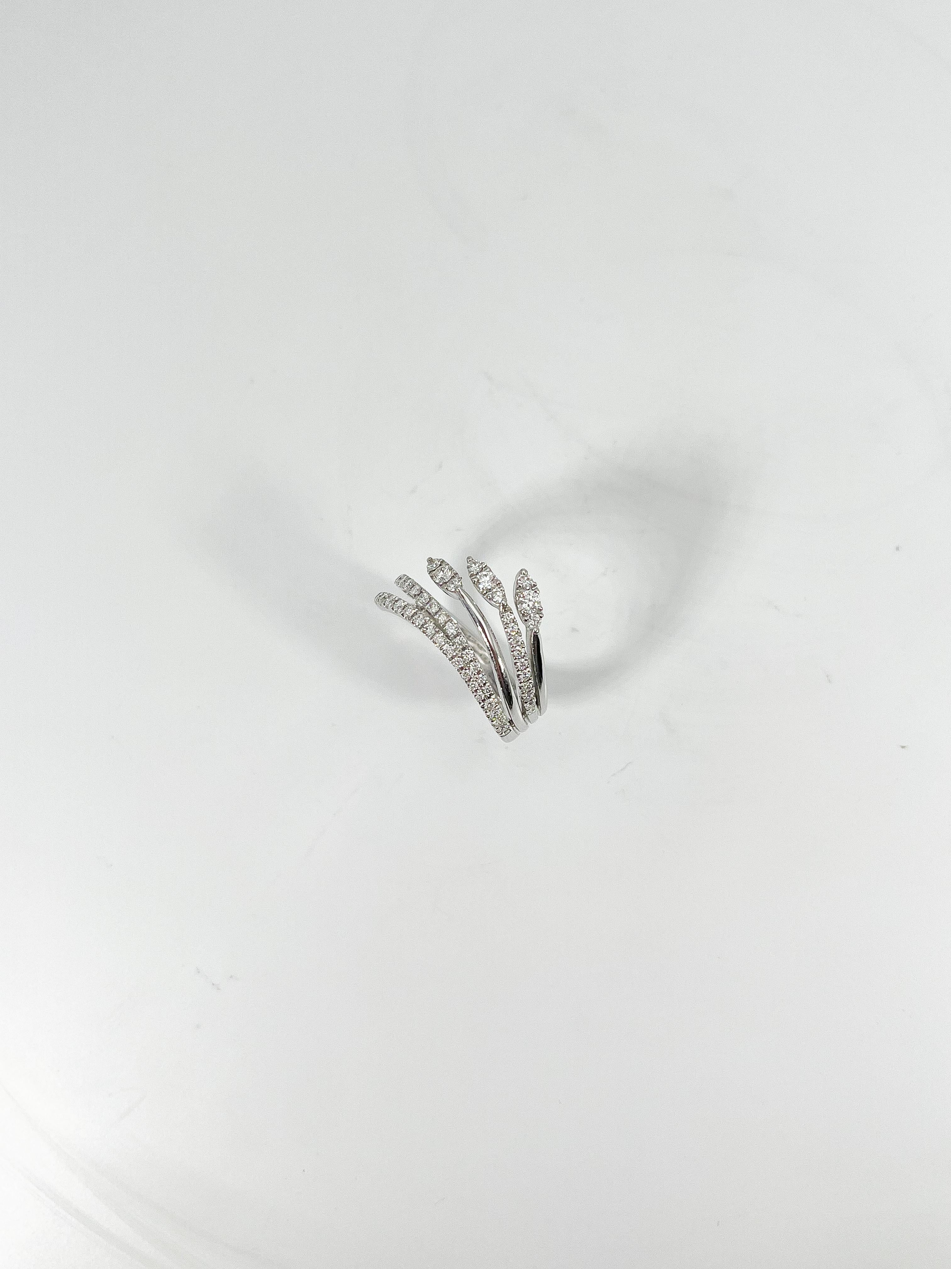 Simon G 18k white gold .50 CTW diamond fashion ring. The diamonds in this ring are all round, the width is 10.8 mm, the ring size is a 6 1/2, and it has a total weight of 4.6 grams.
Part number- LR2541