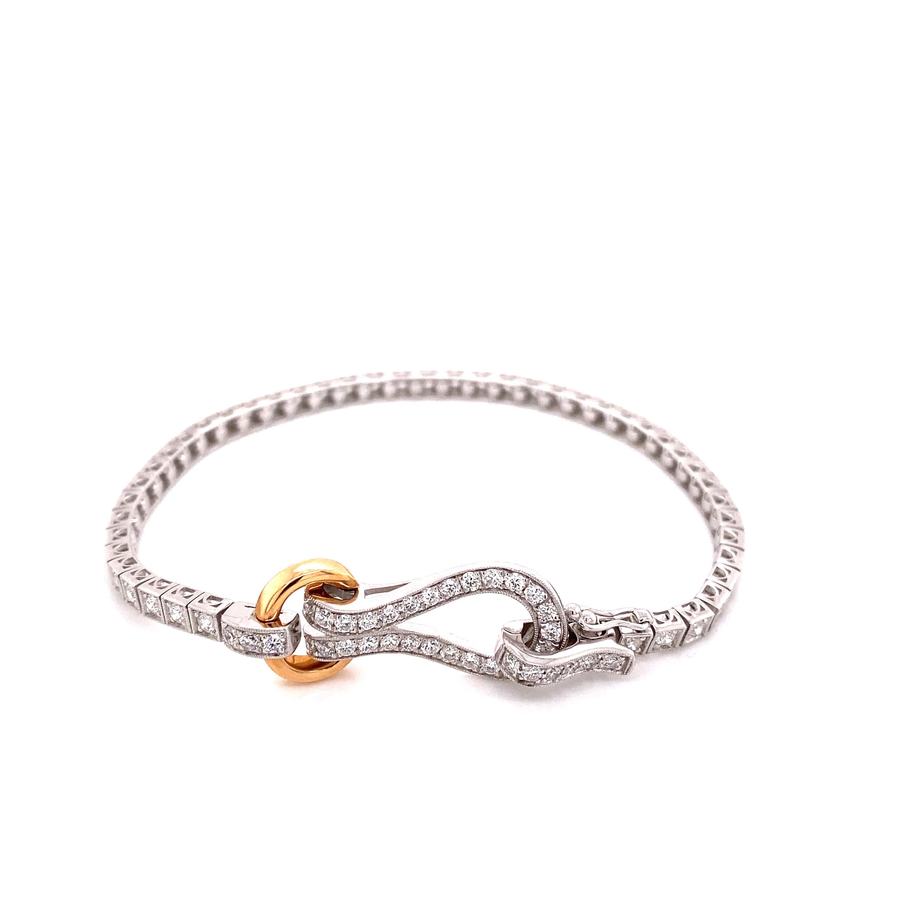 This bracelet from Simon G. features 2.00 carat total weight in round brilliant cut diamonds set in 18 karat white and rose gold with a unique buckle clasp. It is approximately 7