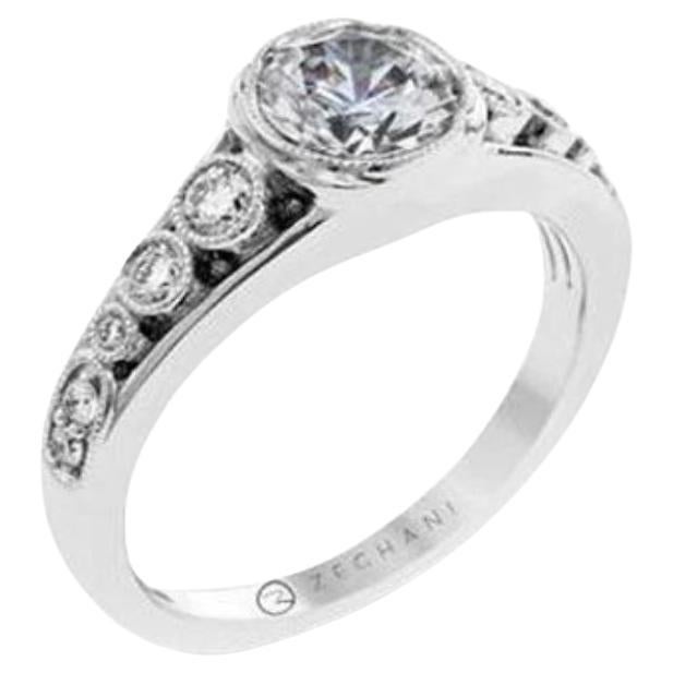 This wonderful Vintage Vixen collection engagement mounting setting is crafted from 14k white gold and features a graduated floated bezel design set with .29 ctw of round white diamonds. Bezels have a vintage inspired milgrain finish. Created for