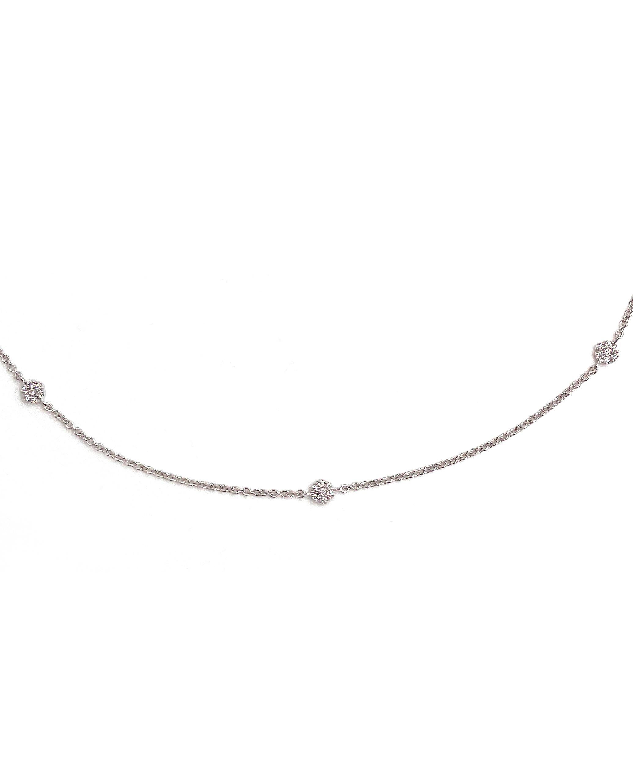 Simon G. 18K White Gold Chain with Double Sided Diamond Stations. There are 98 Round Diamonds Weighing 0.56 carats Total.

*Adjustable 16-18 inches