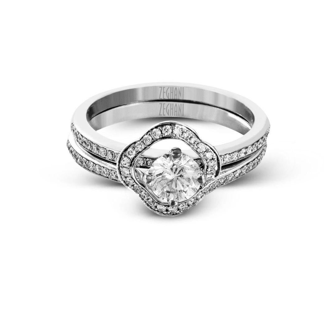 This distinctive Refined Rebel collection wedding set is yet another unique creation by couture bridal jewelry designer Simon G. The 14k white gold band fits around the 14k white gold engagement mounting with a soft quatrefoil shape, making this