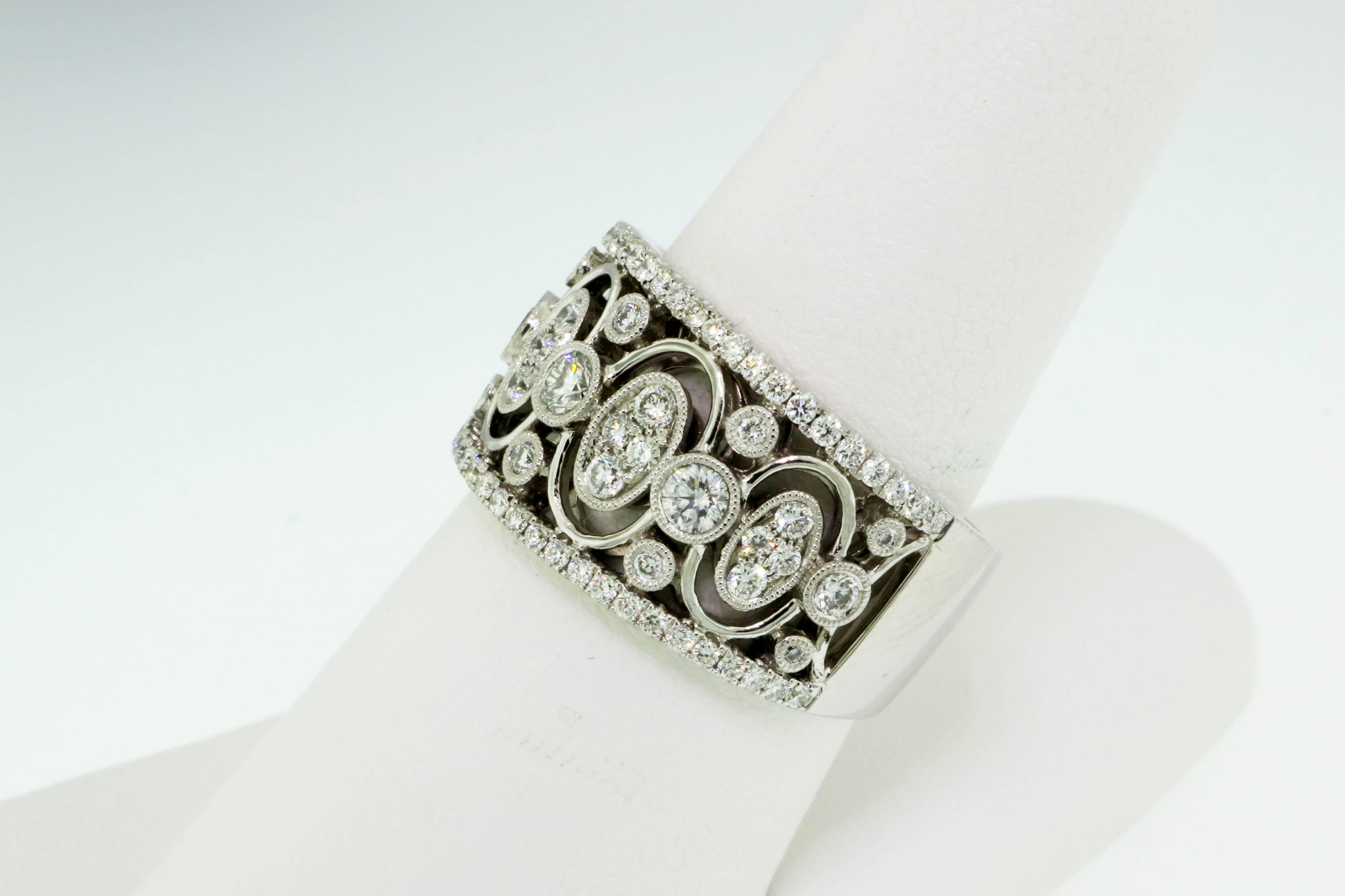 Ring size: 7.75

Incredible Vintage Explorer diamond band ring from jewelry designer, Simon G.. This wide, intricate band ring is filled with Old World elegance and the unique open design fills the finger with sparkle while still remaining delicate.