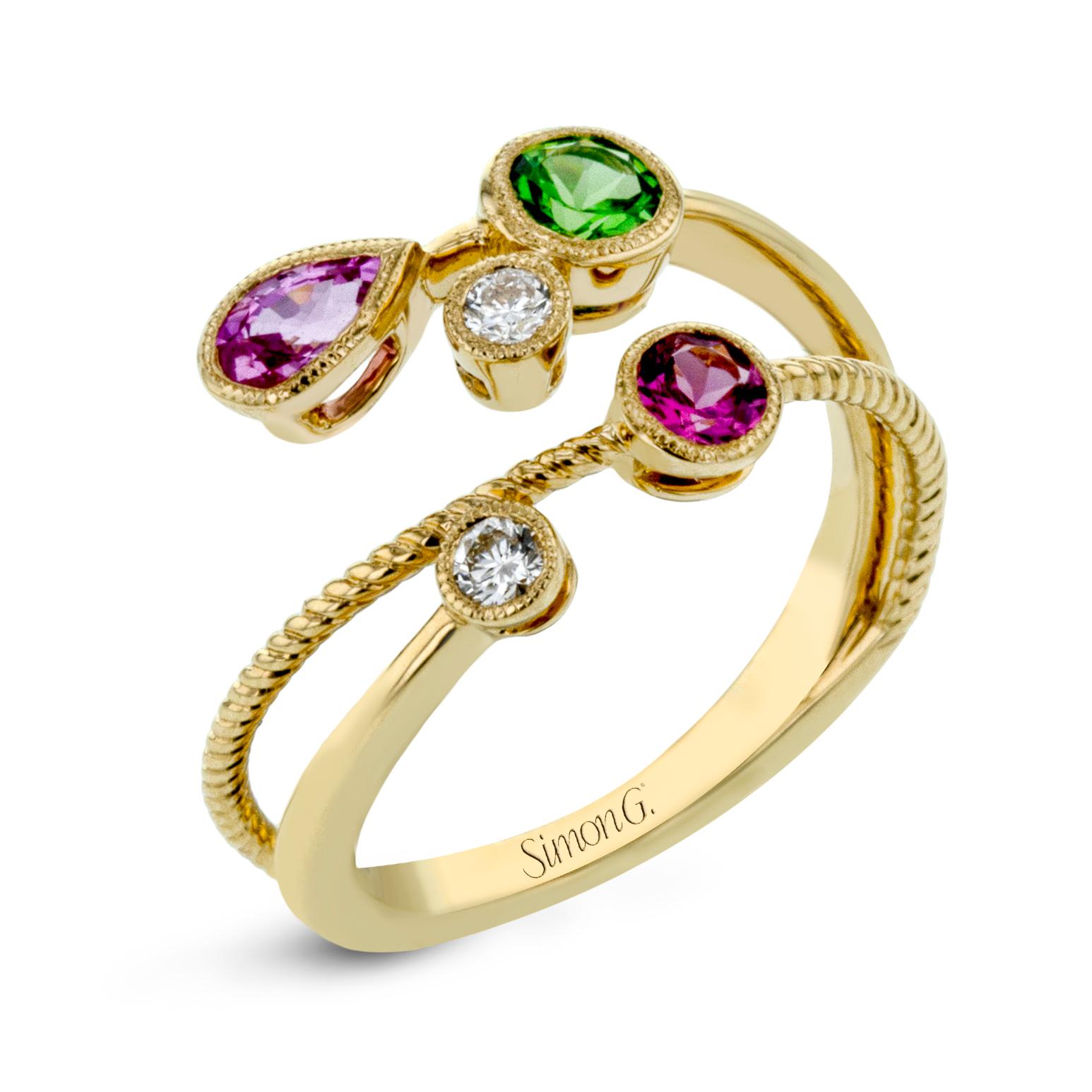 This beautiful and unique ring from Simon G features 0.13ctw of round brilliant cut white diamonds, one 0.30ct  green tsavorite, one 0.28ct pink sapphire, and 0.20 carat of pink spinel set in 18 karat yellow gold with a braided detail on the band.