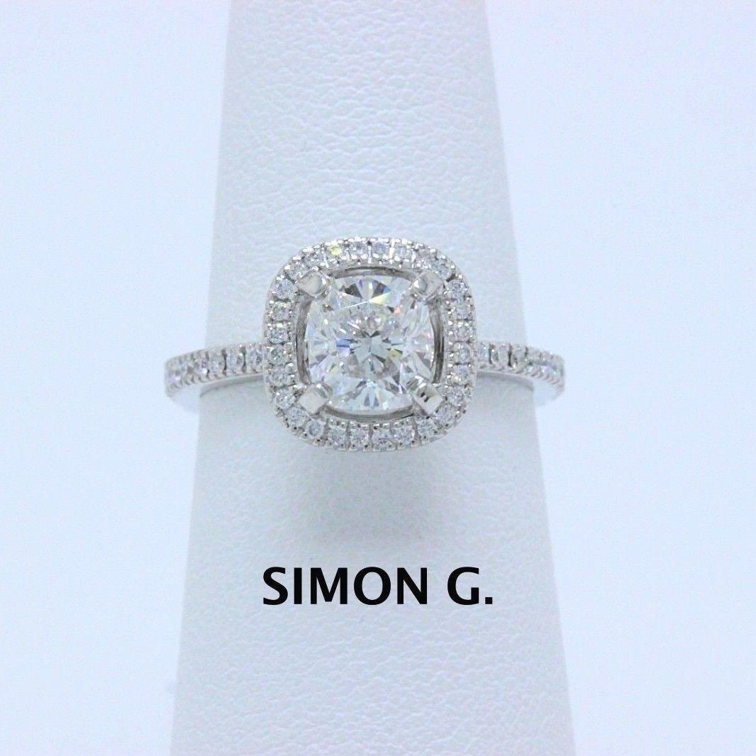 SIMON G. ENGAGEMENT RING
Style:  Solitaire with Halo & Pave Diamond Band
Serial Number:  509106
Metal:  Platinum PT950
Size:  5 - Sizable
Total Carat Weight:  1.31 TCW
Diamond Shape:  Cushion Modified Brilliant 
Diamond Color & Clarity:  F /