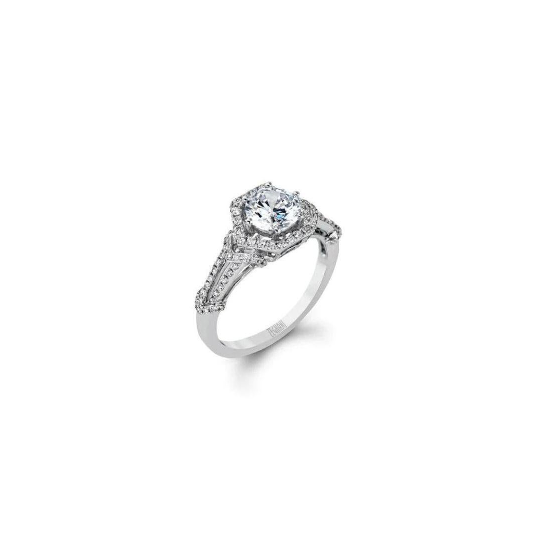 This wonderful vintage-inspired diamond engagement mounting features a hexagonal halo design that evokes the spirit of the Art Deco Era. Ring contains 0.33 ctw of shining white diamonds, G color, VS2 clarity, set in rich 14k white gold. This ring is
