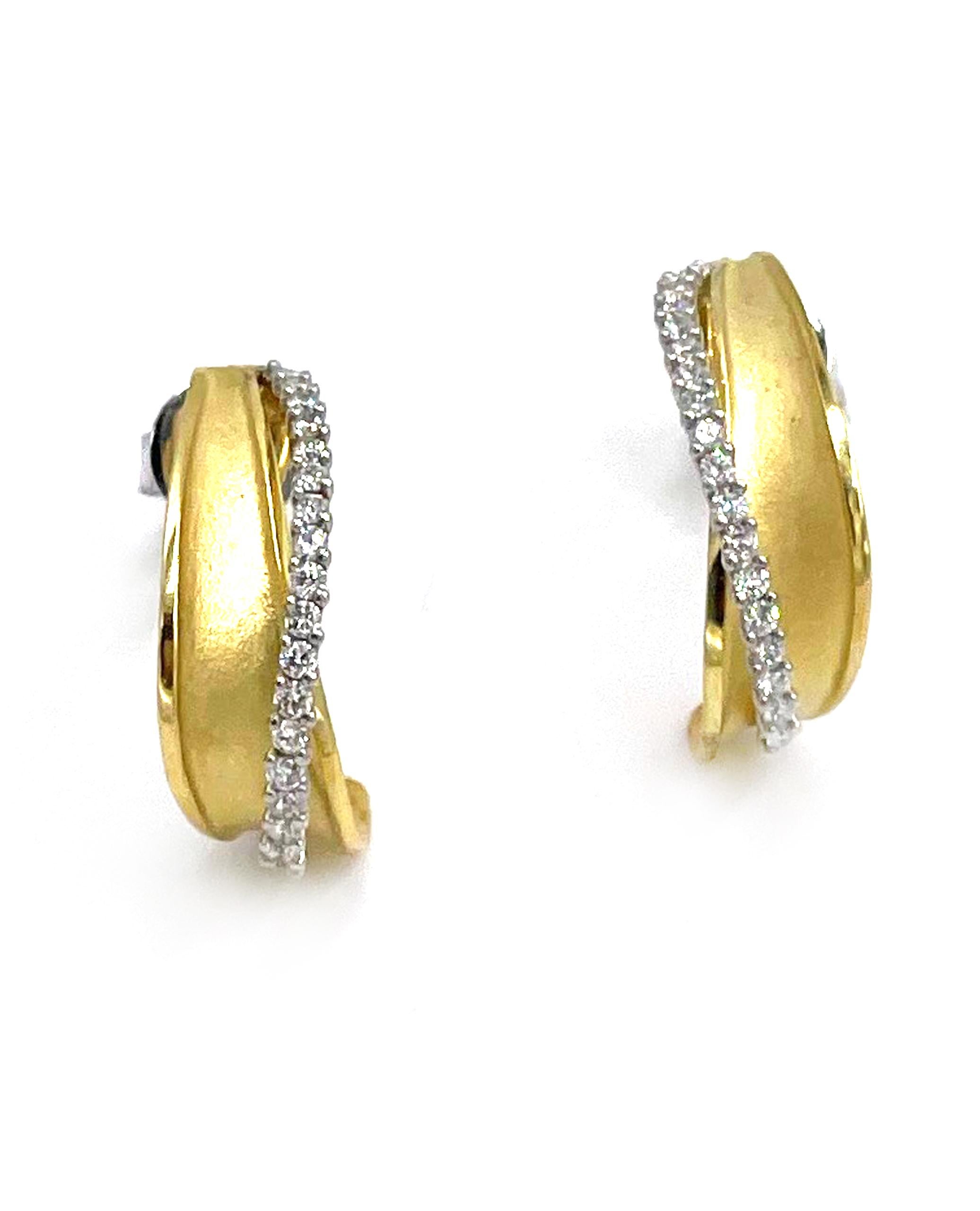 Not your average hoop earring.  Pair of 18K yellow and white gold earrings made by Simon G.  These earrings are furnished with 36 round brilliant-cut diamonds 0.27 carats total weight and a matte finish yellow gold detail. 

* Style No. NE188
* 0.50