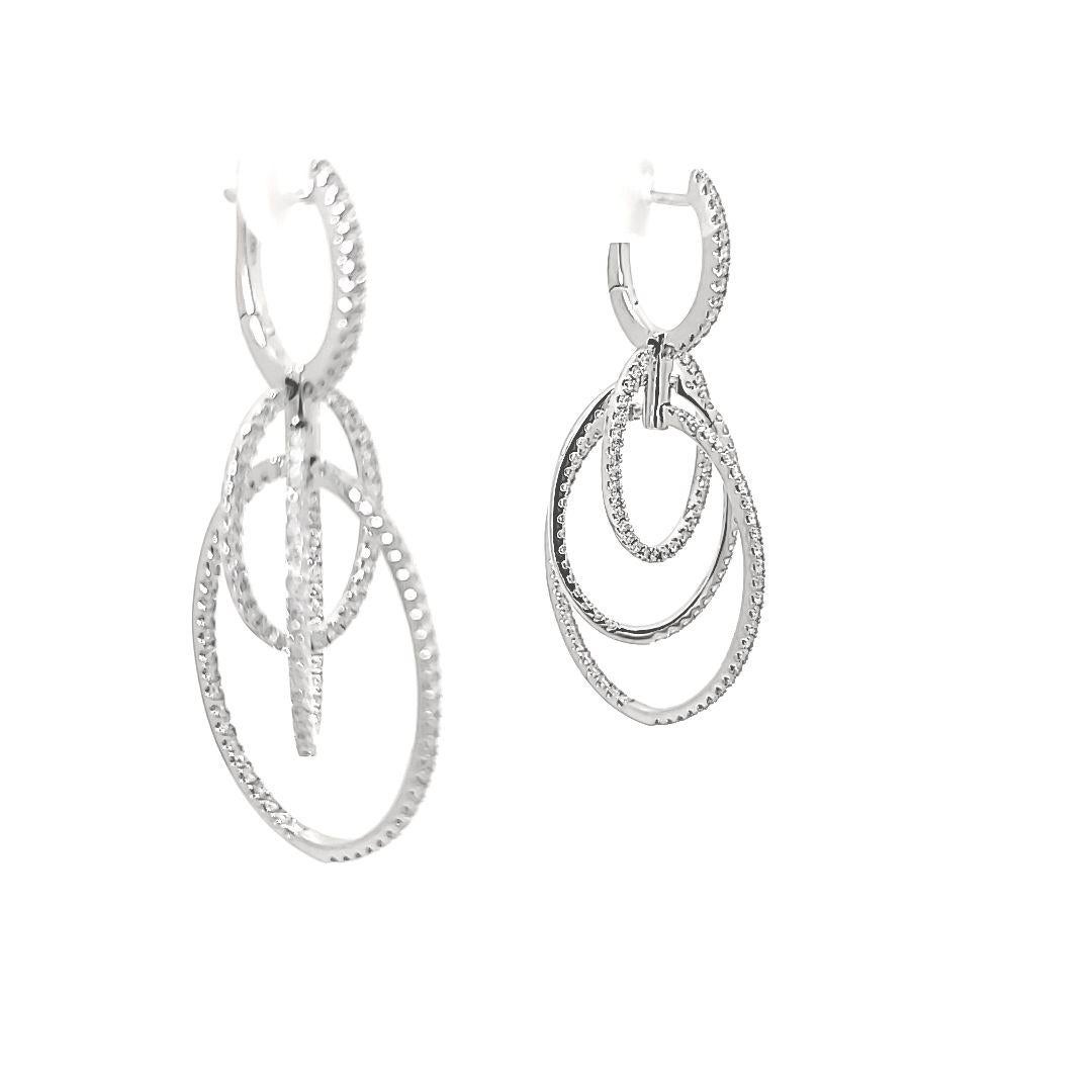 In 18 karat white gold, these Simon G earrings support a total of 1.72 carats of diamonds.  Light and comfortable on the ear! 