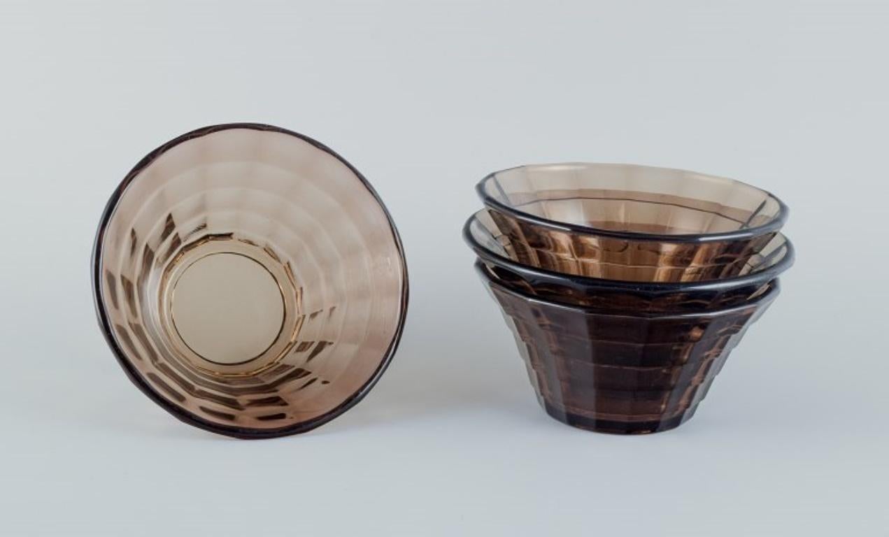 Simon Gate (1883-1945) for Orrefors/Sandvik, Sweden.
Set of four Art Deco bowls in smoked-coloured pressed glass.
Model G756.
Ca. 1940.
In perfect condition.
Dimensions: D 13.8 cm x H 6.0 cm.