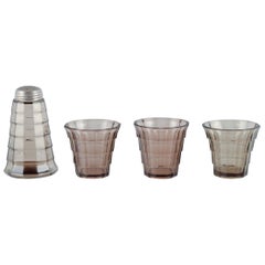 Simon Gate for Orrefors/Sandvik.. Set of three drinking glass and sugar shaker