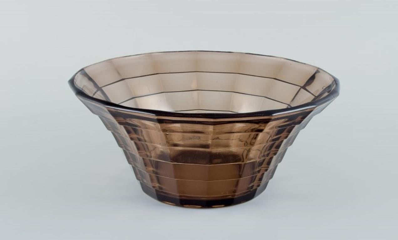 Simon Gate (1883-1945) for Orrefors/Sandvik, Sweden.
Two large Art Deco bowls in smoked-coloured pressed glass.
Model G756.
Circa 1940.
In perfect condition.
Dimensions: D 22.5 cm x H 10.0 cm.
