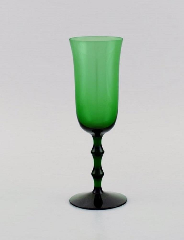 Simon Gate for Orrefors. Three Salut champagne glasses in green mouth-blown art glass. 
Swedish design, 1920s / 30s.
Measures: 18 x 5.7 cm.
In perfect condition.