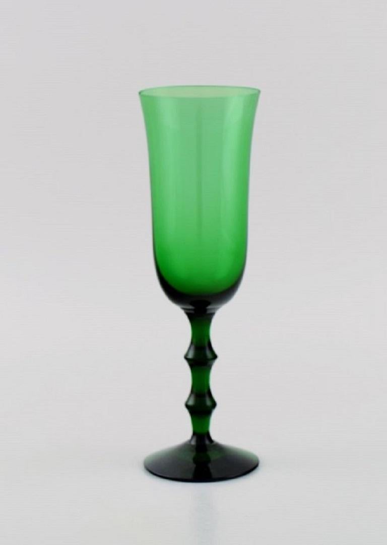 Simon Gate for Orrefors. Three Salut champagne glasses in green mouth blown art glass. 
Swedish design, 1920s / 30s.
Measures: 18.7 x 6 cm.
In perfect condition.