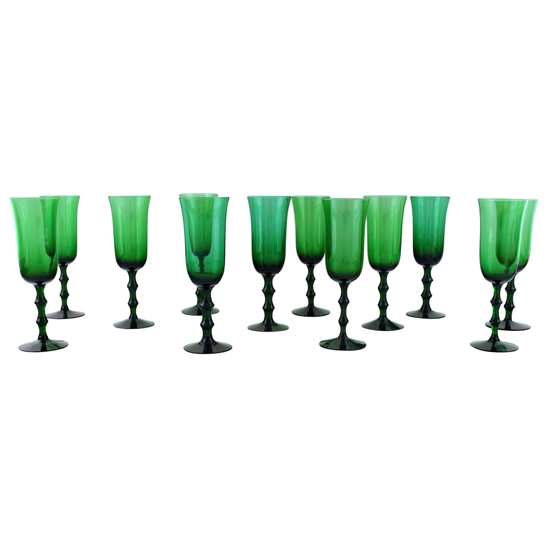 Simon Gate Orrefors, a Set of 12 Green Champagne Glasses in Art Glass