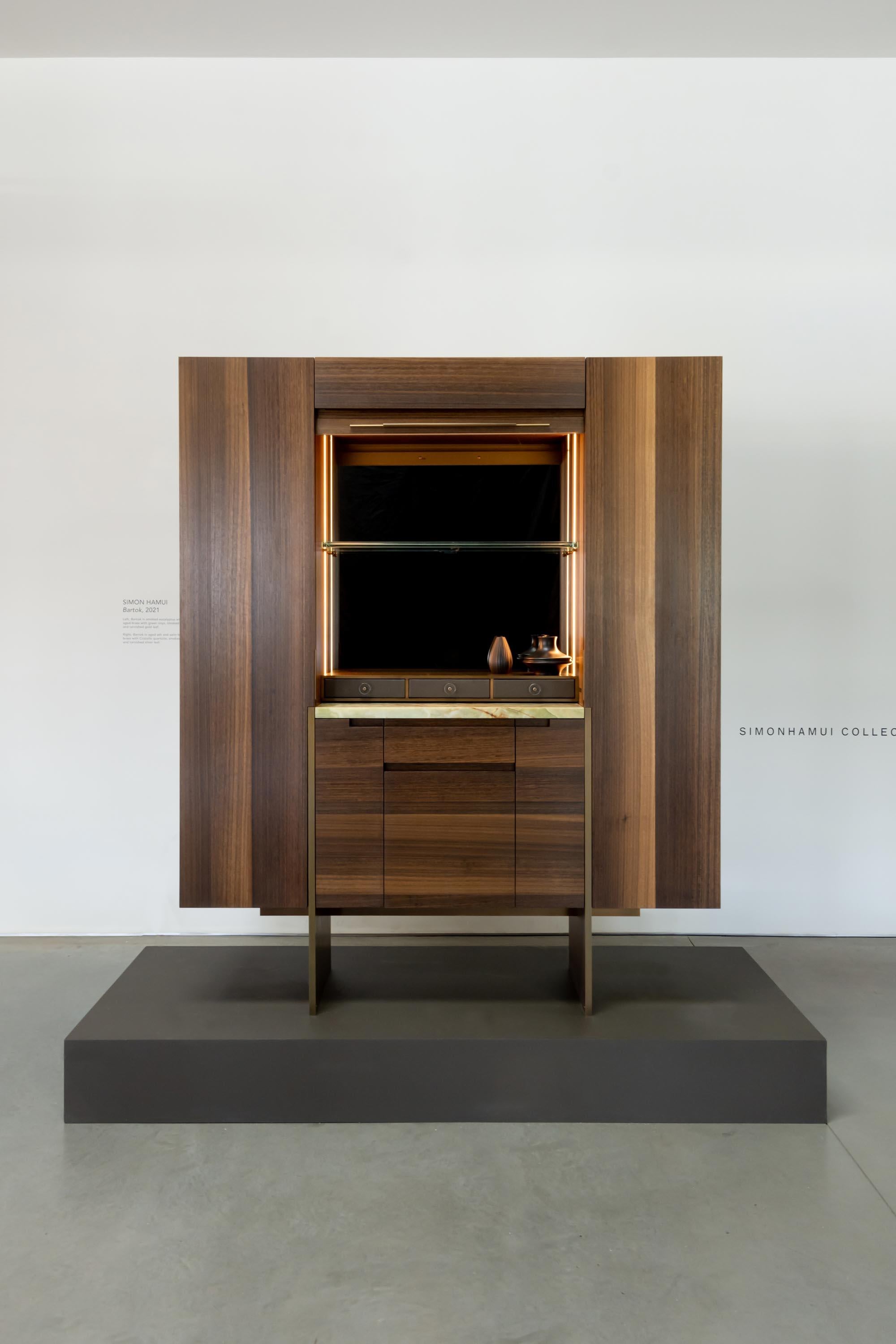 Bartok, the founding piece of Simon Hamui Collectibles, is a limited edition standalone bar cabinet launching in a series of 6, each distinguished in materials and colors. 

The first is finished in a smoked eucalyptus with a brushed and oiled