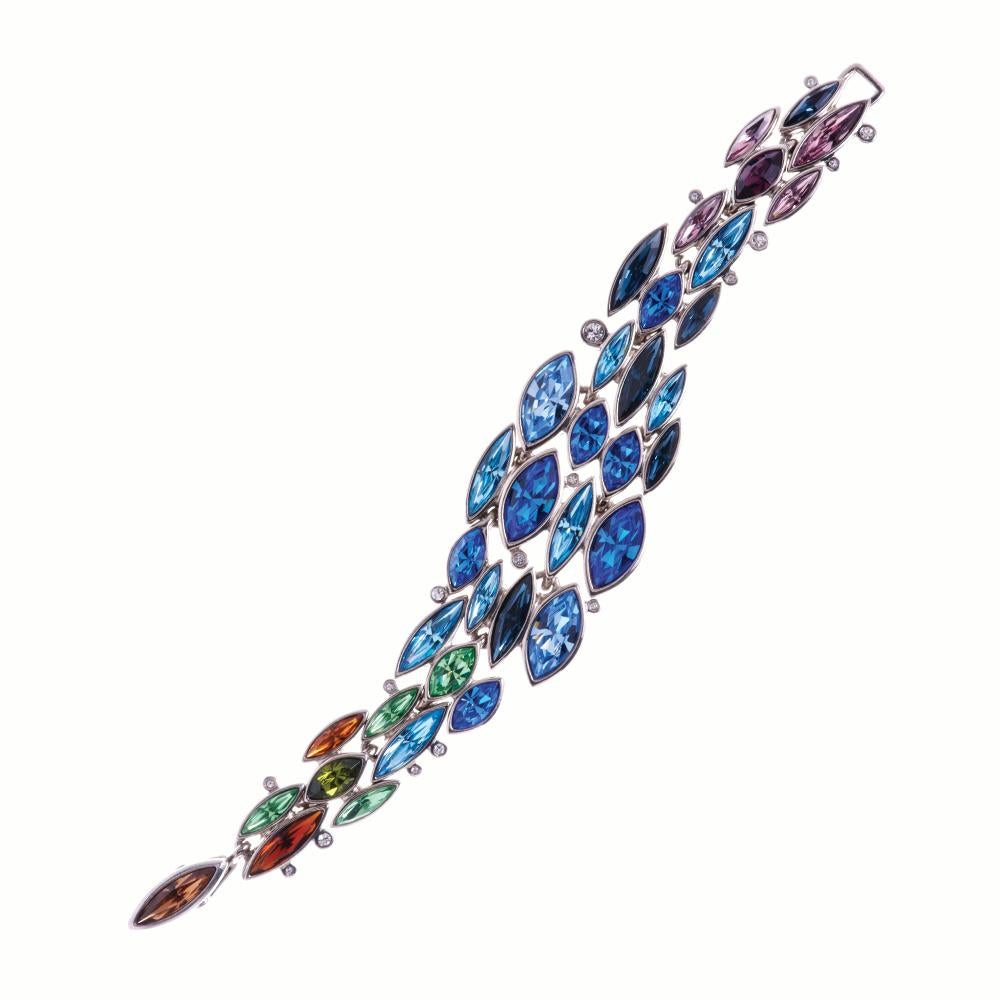 Our Aquarius bracelet features a sophisticated mix of Swarovski crystal evocative of a seascape at sunset. Fastened by way of a discreet fold over clasp, small round clear crystals echo the reflections from breaking waves, giving the piece it’s own