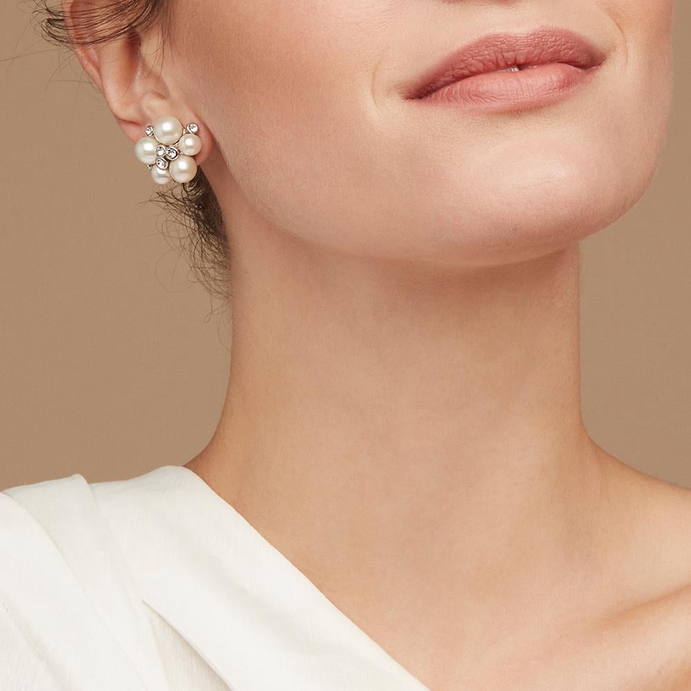 With influences drawn from the late 1950s early 1960s, this statement collection is sure to add a classically refined elegance to any look. These earrings showcase had set pearls and delicate Swarovski® crystals placed by our skilled master