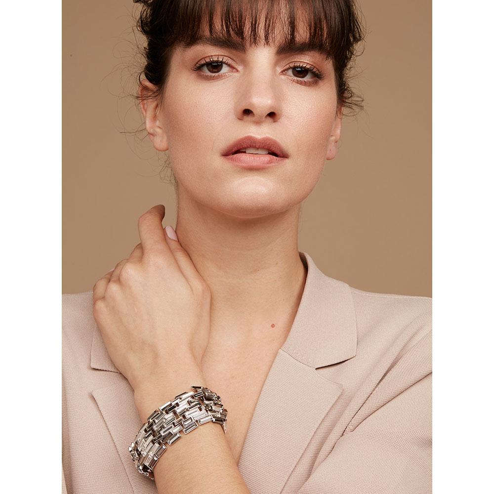 Like pure spring water, the Caddis crystal bracelet flows effortlessly around one’s wrist, and with it’s curved surface constantly reflects captured light in subtly different tones.

This collection evokes half-remembered childhood adventures by a