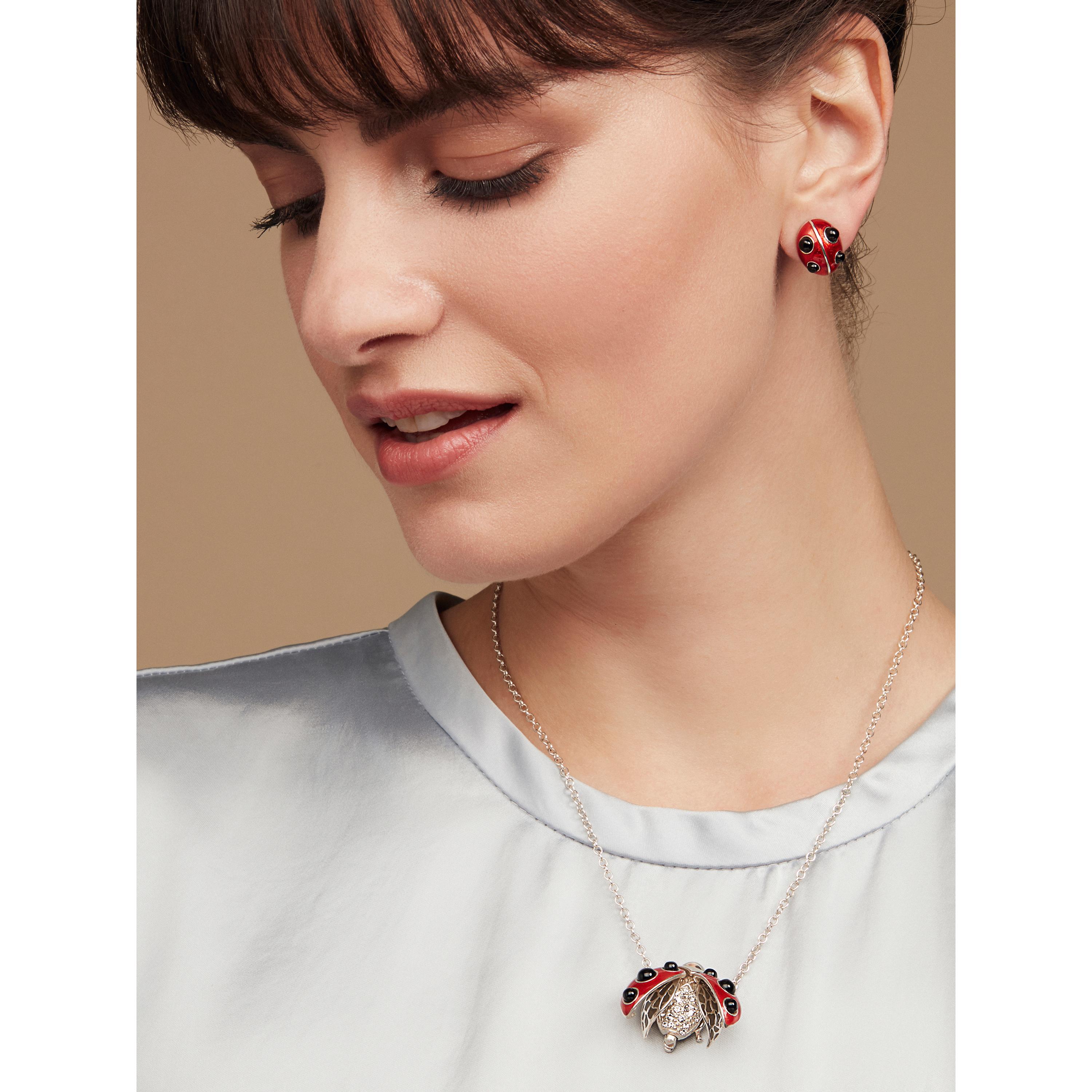 This Ladybird pendant perfectly embodies love, full of crafted details and charm. It is set with real onyx stones with hand enamelling. Its wing cases spring open to reveal ‘plique-a-jour’ enamelled wings and a hand set crystal encrusted body.
