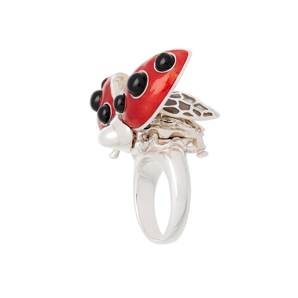 This beautifully crafted sterling silver piece has an intricate mechanism and a secret message. Our ladybird springs her wings in a simple manner to reveal her plique-a-jour enamelled inner wings and a body encrusted with Swarovski crystals. 
 
Our