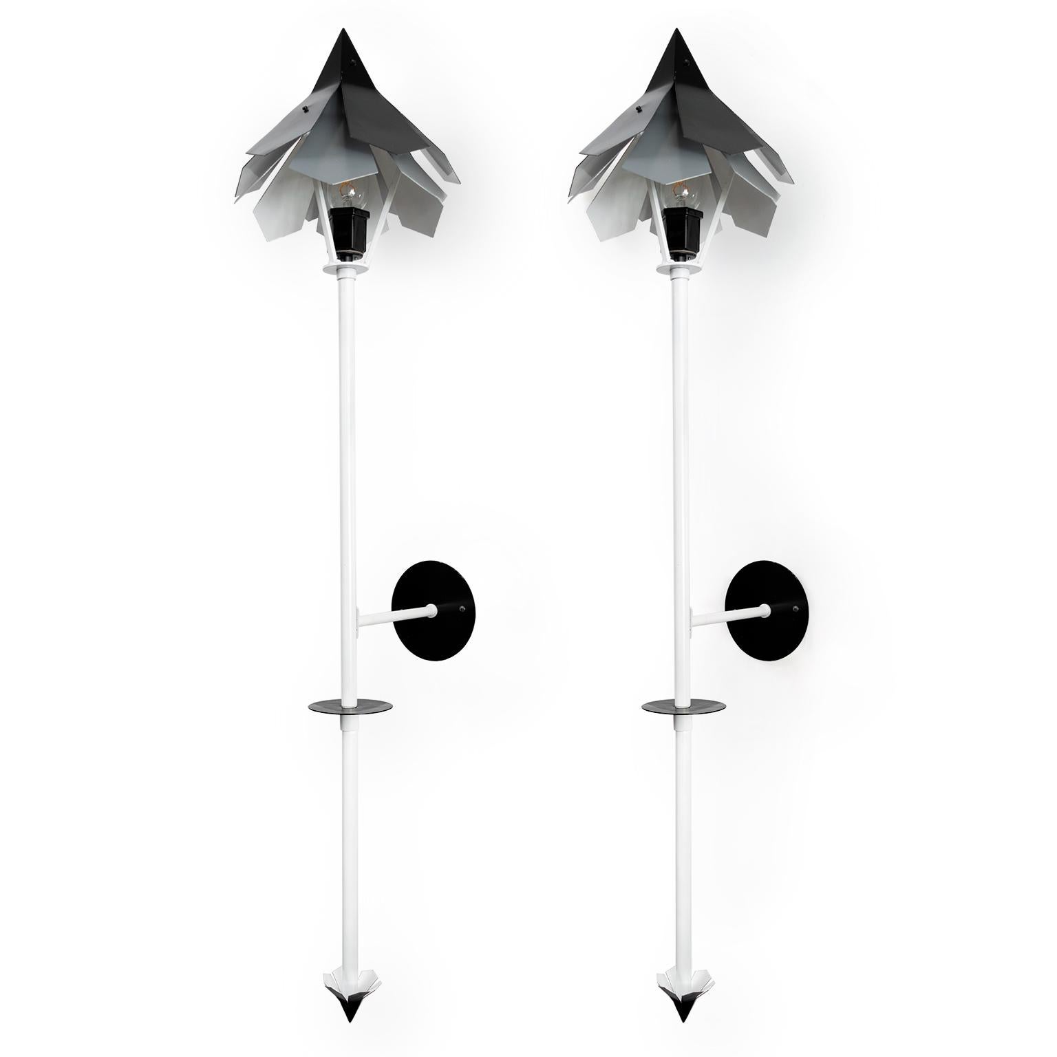 A pair torch lamps designed by Simon Henningsen (son of Poul) for the Tivoli Gardens (1962) in Copenhagen, Denmark. These lamps have been adapted into wall-mounted lamps, newly painted and wired for use in the USA with a single porcelain Edison base