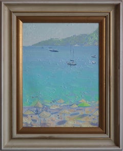 Yachts and umbrellas on the beach