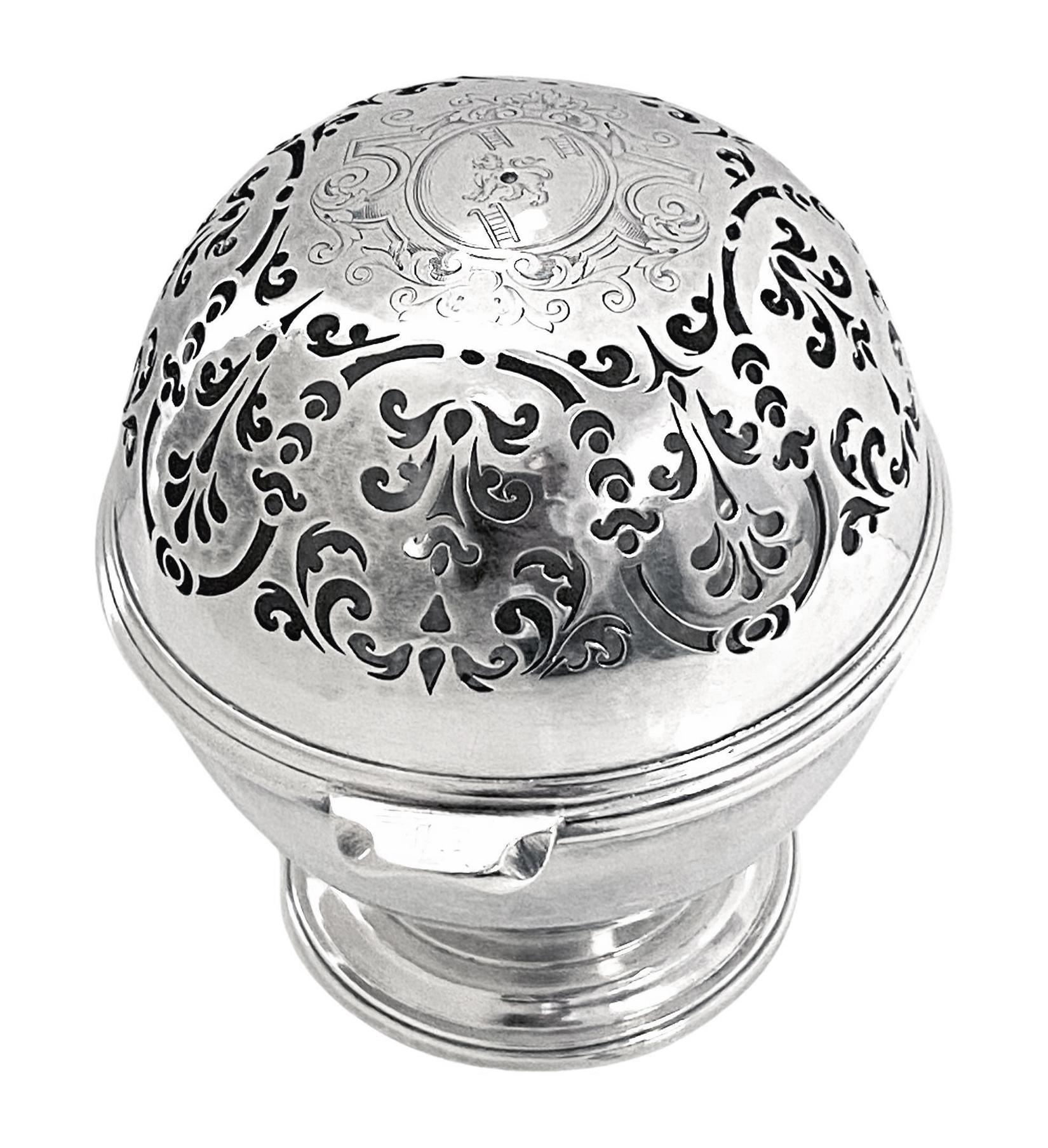 George 1st Britannia standard soap sponge or potpourri Bowl London 1717 Simon Pantin. Of spherical form, hinged cover very finely pierced foliate patterns, the centre engraved for Morris, Co Cardigan with the coat of arms a lion passant between