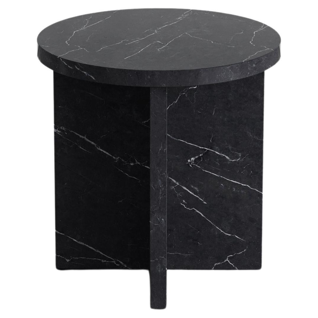 Simone 45 Side Table by Agglomerati. 
Dimensions: D 45 x W 45 x H 45 cm. 
Materials: Black Marquina. Available in other stones. 

Agglomerati is a London-based studio creating distinctive stone furniture. Established in 2019 by Australian