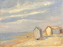 Antique Beach Huts on a Tranquil Shore with Figures Relaxing under a Soft Blue Sky