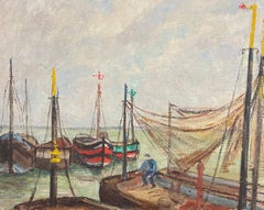 Scène de port avec pêcheurs et bateaux colorés Filets relevés Port Étalpes France