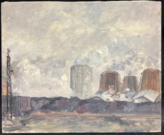 Industrial Landscape with Smokestacks and Cooling Towers Under a Cloudy Sky