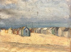 Scène côtière vintage avec huttes de plage altérées le long d'une côte de sable
