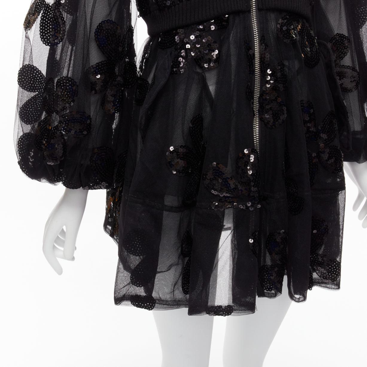 SIMONE ROCHA 2023 black sequin embellished tiered tulle fitted bomber coat UK6 XS
Reference: AAWC/A00525
Brand: Simone Rocha
Collection: 2023
Material: Polyester
Color: Black
Pattern: Sequins
Closure: Zip
Extra Details: The ethereal style of