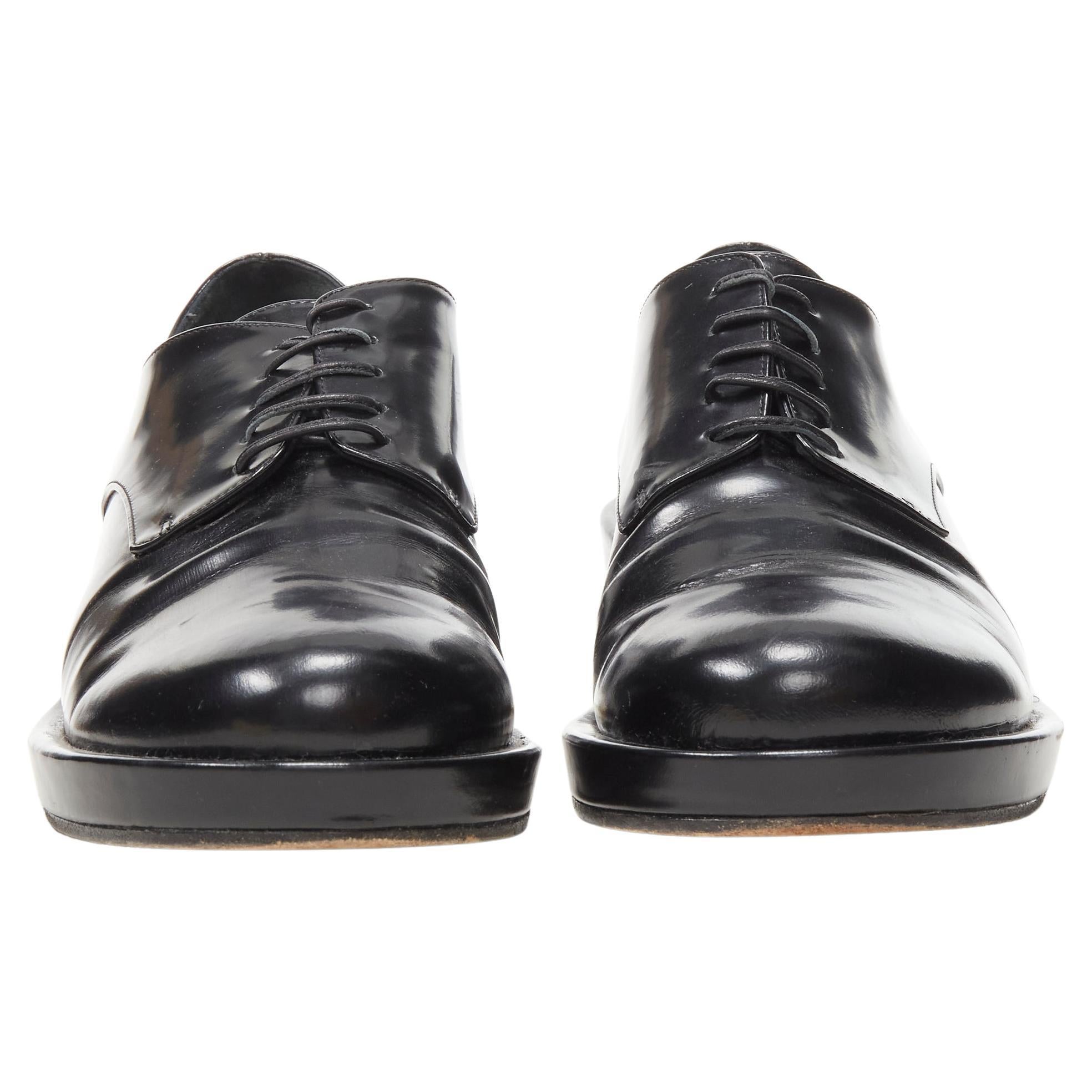 SIMONE ROCHA black polished leather perspex heel  oxford brogue EU38
Brand: Simone Rocha
Material: Leather
Color: Black
Pattern: Solid
Closure: Lace Up
Extra Detail: Polished leather upper. Leather lace. Clear perspex heel.
Made in: