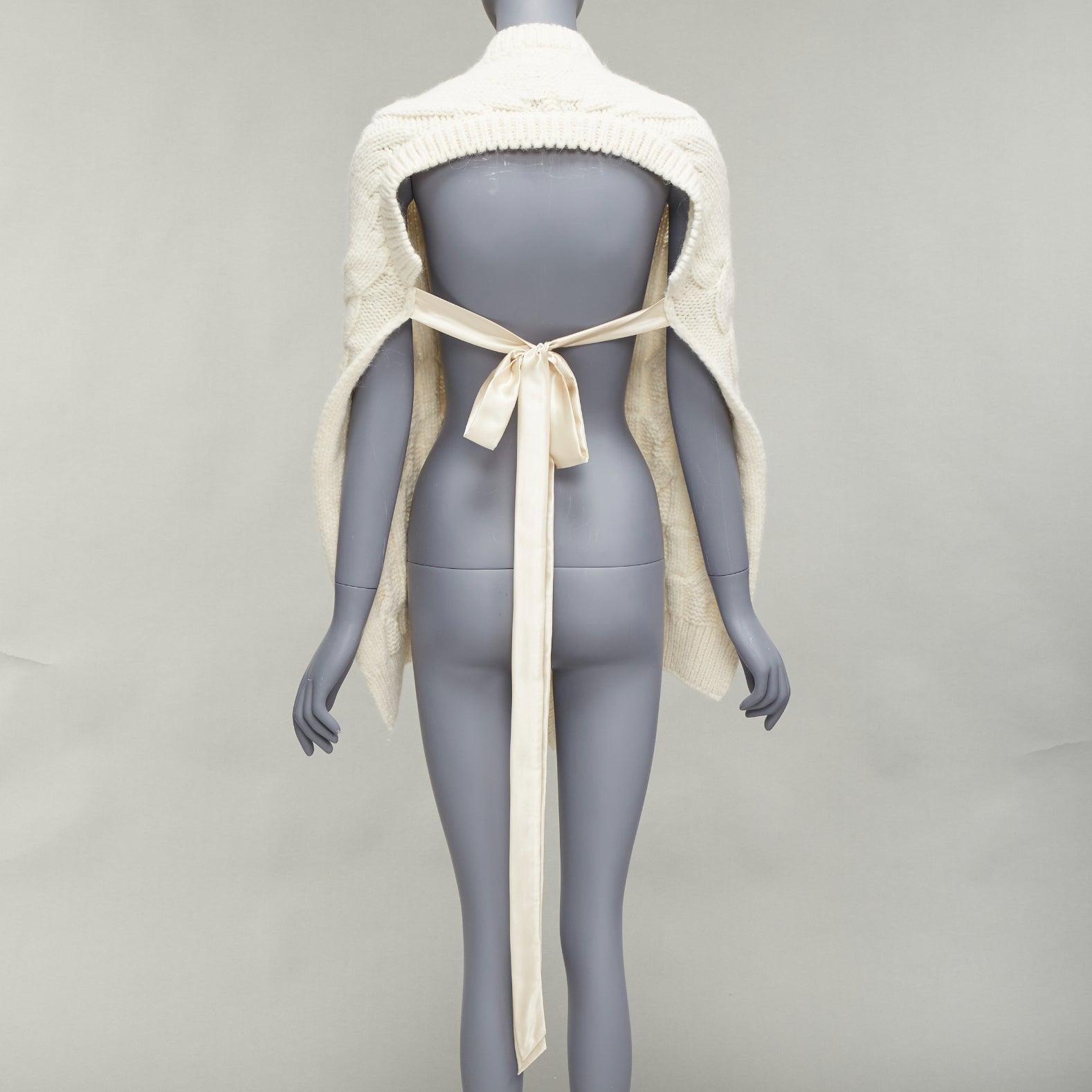 SIMONE ROCHA cream alpaca ribbon tie open back draped cable knit top S
Reference: LNKO/A02257
Brand: Simone Rocha
Material: Alpaca, Blend
Color: Cream
Pattern: Solid
Closure: Self Tie
Extra Details: Ribbon tie and open back at back.
Made in: