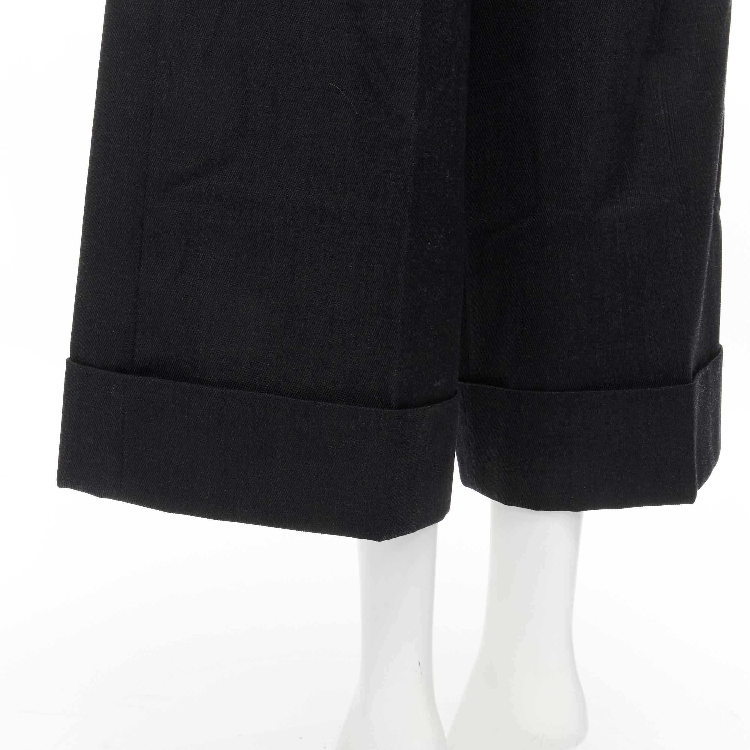 SIMONE ROCHA dark grey heavy cotton-blend pleated cuffed wide leg trousers UK6 XS 
Reference: MELK/A00075 
Brand: Simone Rocha 
Material: Polyester 
Color: Grey 
Pattern: Solid 
Closure: Zip Pleat front. 3-pockets. Cuffed hem. 
Made in: Portugal