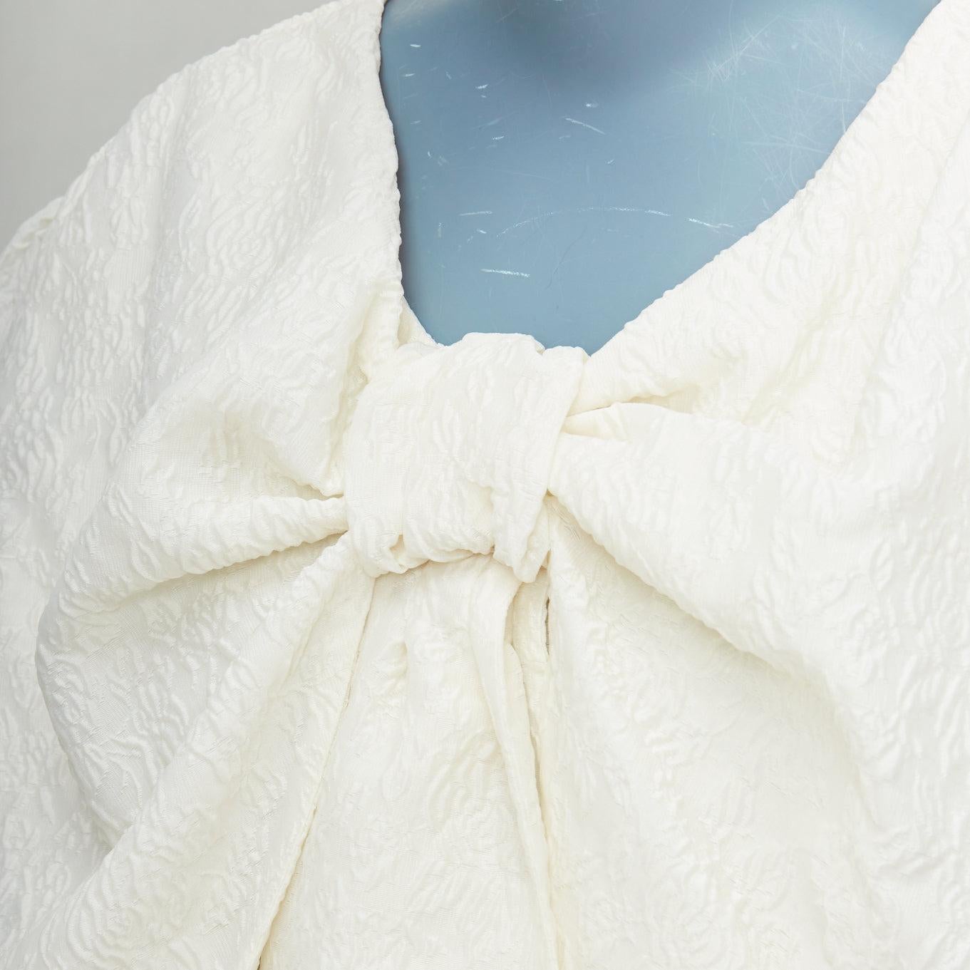 SIMONE ROCHA off white front bow cloque puff mini dress UK6 XS
Reference: KYCG/A00090
Brand: Simone Rocha
Material: Polyester, Blend
Color: Cream
Pattern: Brocade
Closure: Zip
Lining: Cream Fabric
Extra Details: Polyester and nylon-blend cloque