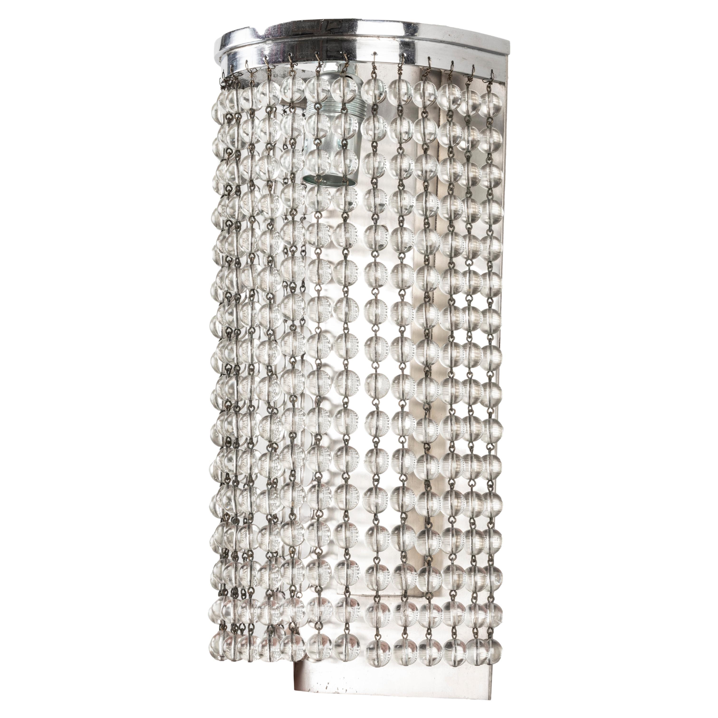Simonet (attributed to) Cascade Art Deco Pair of Sconces in Bronze and Crystal Beads.
Pair of Wall lights with nickel-plated metal fixing plate, enclosing a curtain of rows of pearls.
Perfect overall condition, authentic items
Price of the pair of