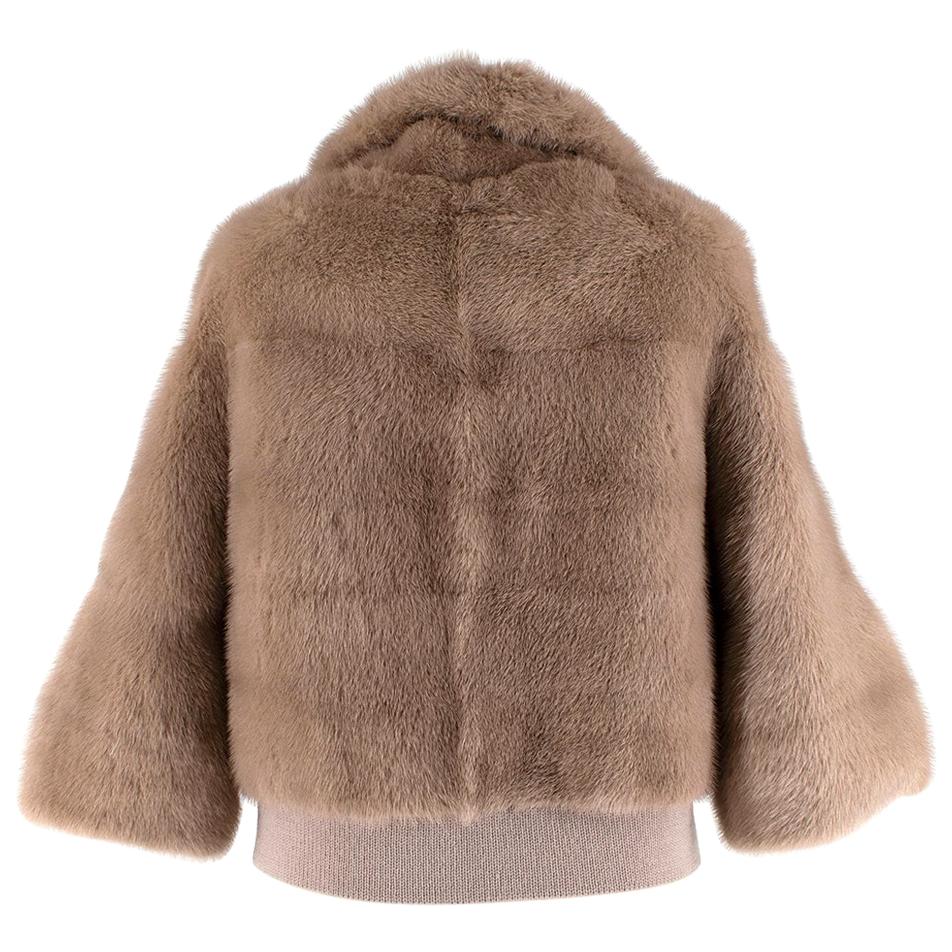 Simonetta Ravizza Beije Mink Fur Jacket  

-Spectacular soft texture 
-Luxurious silk lining with a dotted pattern 
-Concealed hook fastening to the front 
-knit elasticated waist with a  pressure button fastening 
for comfort  

Materials:

100%