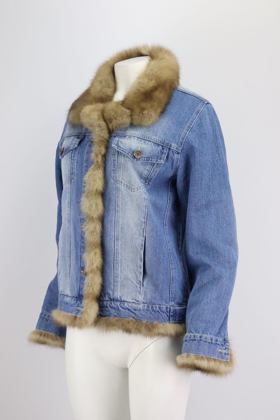 This denim jacket by Simonetta Ravizza channels this season's trend with denim style, it's fully lined for warmth in rabbit fur and trimmed with mink fur, but still layers easily over chunky sweaters. Brown mink and rabbit fur, blue denim. Button