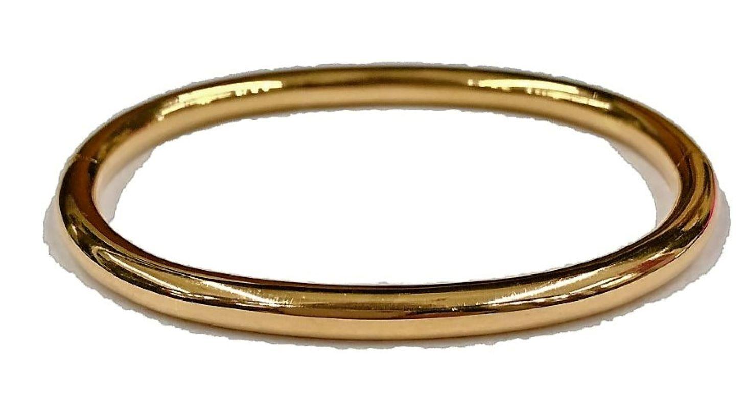 This perennial classic bangle bracelet is made of 18k rose gold and will be a comfortable fit for any medium to large wrist. the tubing itself is .20 inches in diameter and the bracelet is designed with hinge and plunger clasp that makes it very