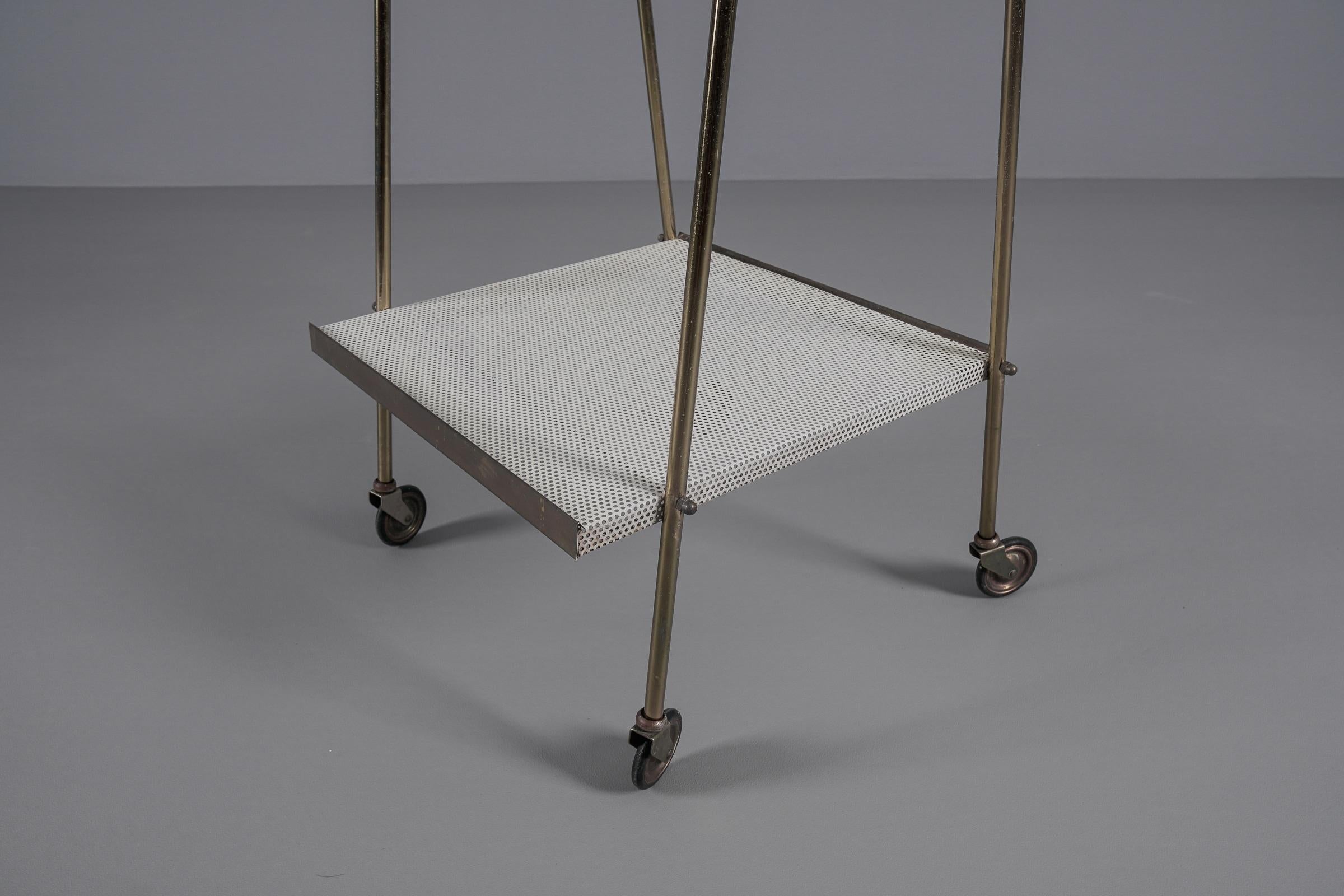 Mid-20th Century Simple and elegant brass and perforated metal bar cart in the manner of Mathieu 