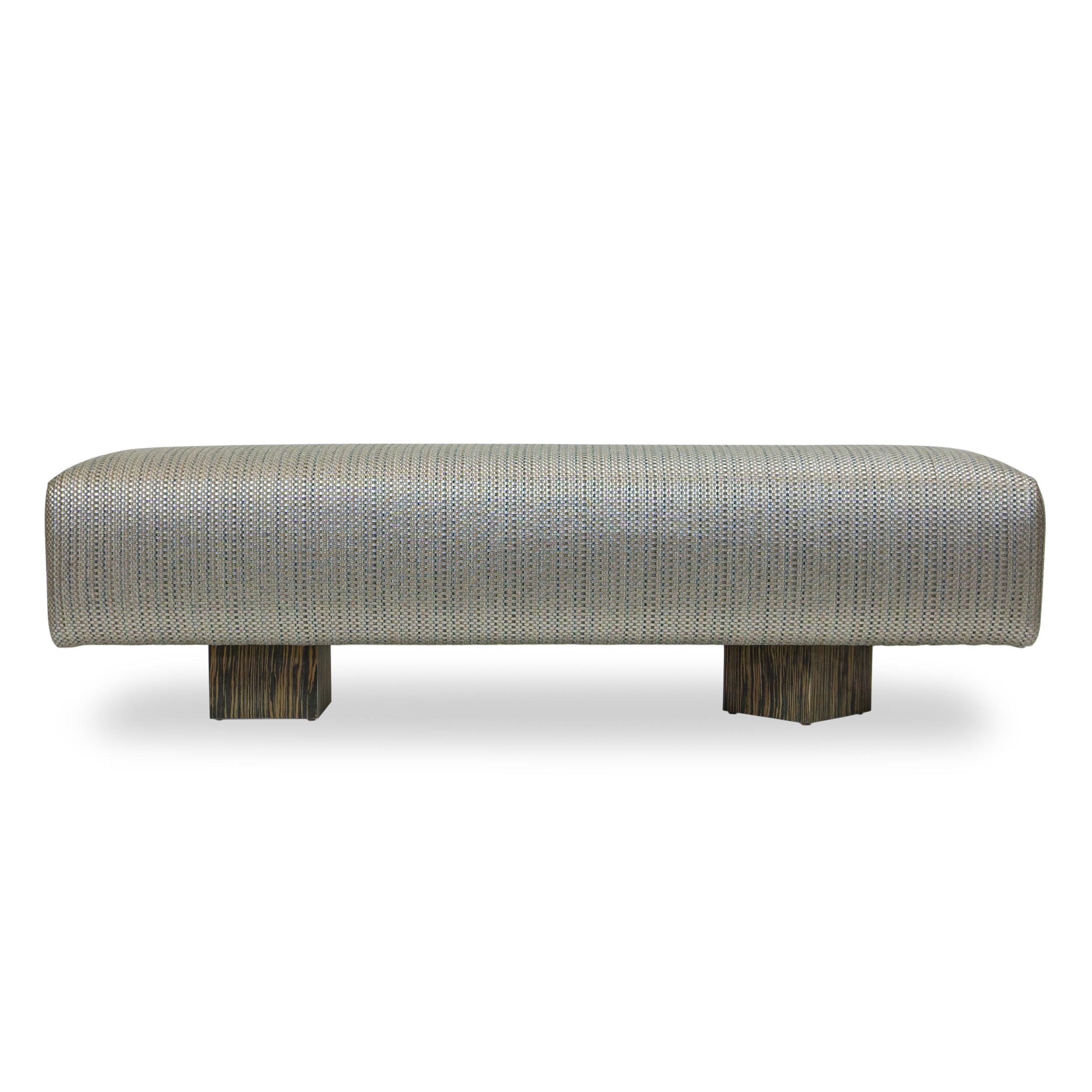 Simple bench made with solid hard maple upholstered in faux leather with silver and rose quartz colors. Decorative wood veneer feet.

Measurements:
70”W x 18”H x 17”D
Seat height: 18