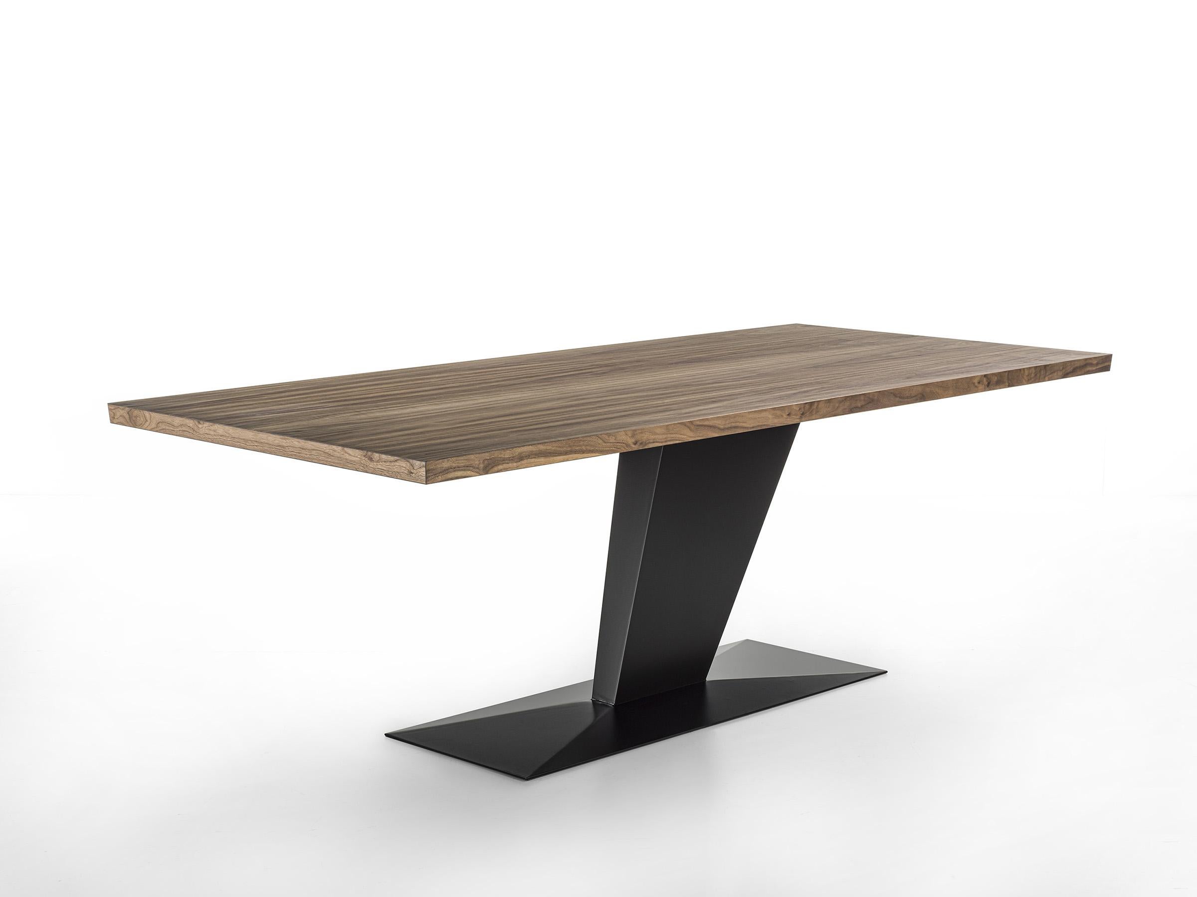 Table with blockboard veneered top and bevelled edges, combined with an iron base consisting of an asymmetrical, slanted leg positioned laterally, and a floor plate. 

Designed by Studio Excalibur and made in Italy. 

Variations:
- Wood