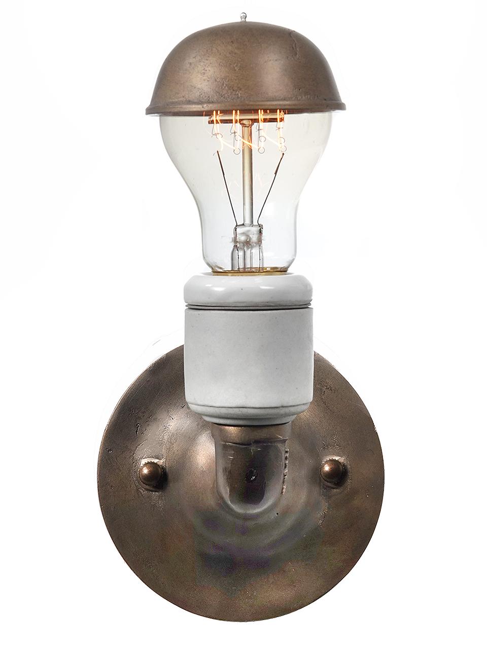 We have a nice collection of these simple brass and porcelain sconces. This is as simple and elegant as it gets. It also includes a unique cast brass cap thats will reduce bulb glair.