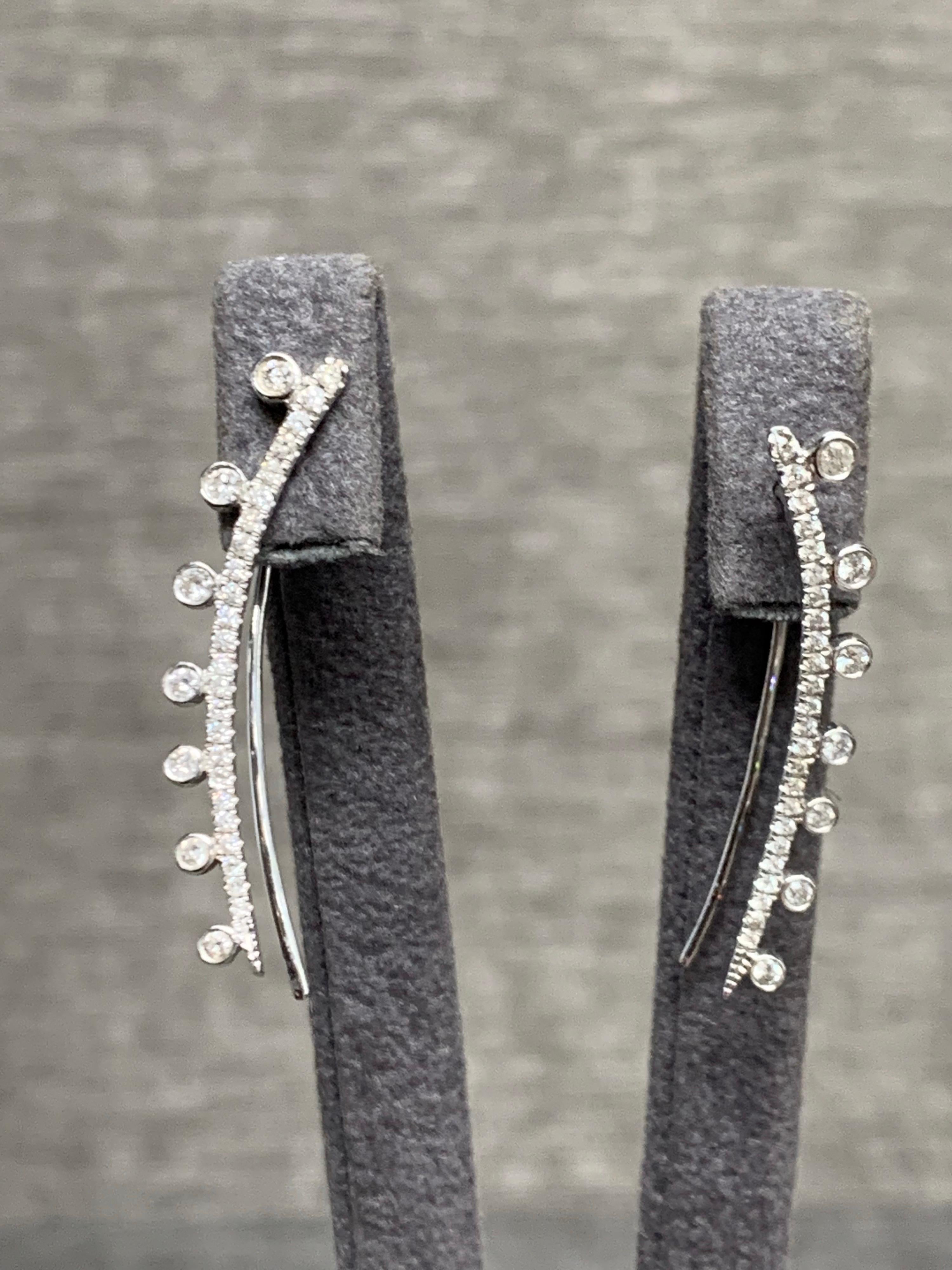 White Diamond, White Gold Earrings.

Featuring a pair of White Diamond Earrings with a total weight of 0.50 carats, set in 18K White Gold. 

This one-of-a-kind pair of earrings was created by hand is certified, appraisal included, 100% insured.